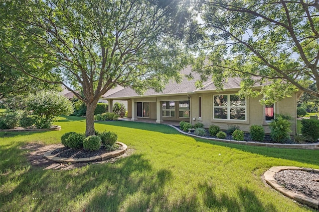 9704 Freeport Dr, Denton, TX 76207 - rear view of house featuring stucco siding, a yard, and roof with shingles