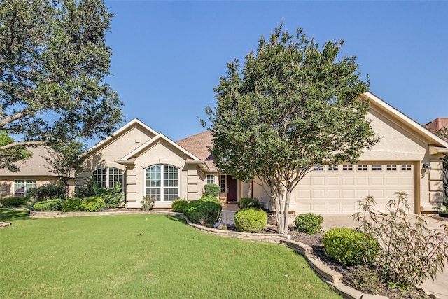 9704 Freeport Dr, Denton, TX 76207 - view of front facade featuring an attached garage, a front lawn, and stucco siding