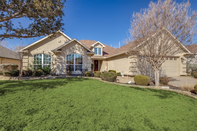 view of front of house featuring a garage and a front yard