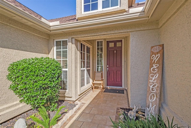 9704 Freeport Dr, Denton, TX 76207 - doorway to property featuring stucco siding