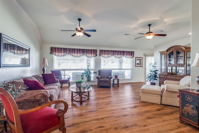 living room featuring vaulted ceiling, hardwood / wood-style floors, and ceiling fan