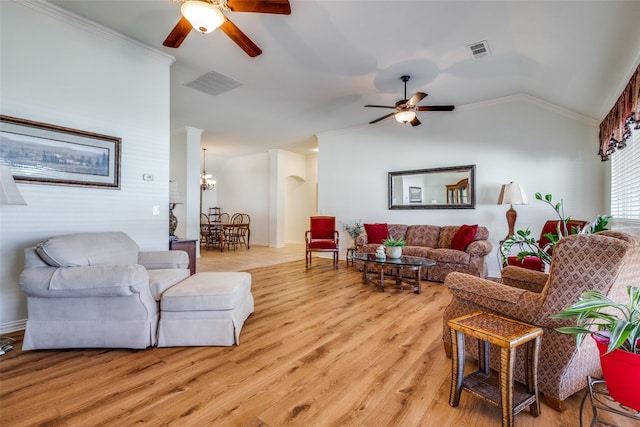 living room with lofted ceiling, ceiling fan with notable chandelier, and light hardwood / wood-style flooring