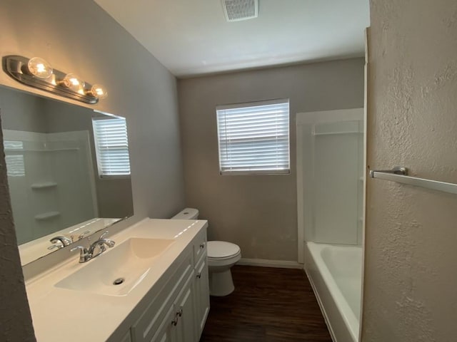 bathroom with vanity, wood-type flooring, and toilet