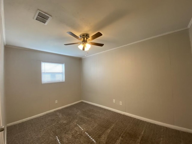 carpeted spare room with ornamental molding and ceiling fan