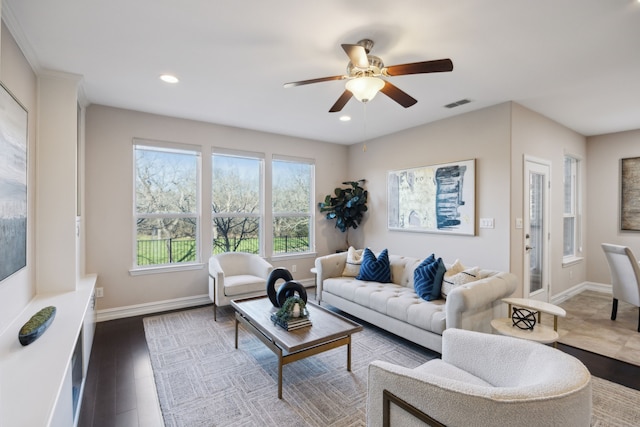 living room with ceiling fan and hardwood / wood-style floors