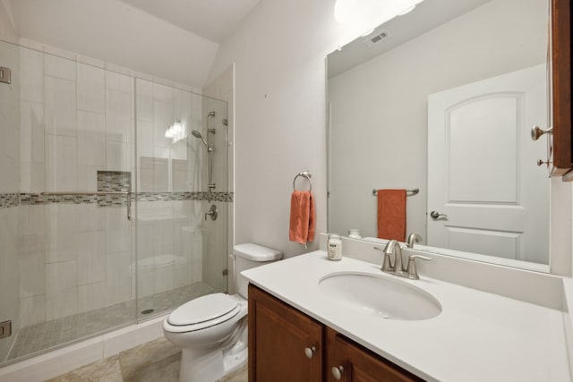 bathroom featuring walk in shower, lofted ceiling, vanity, and toilet