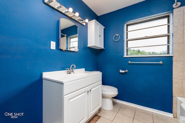 bathroom featuring tile patterned flooring, vanity, and toilet