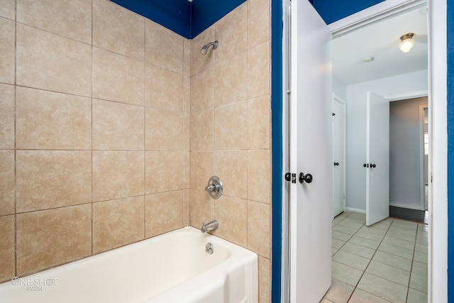 bathroom with tiled shower / bath combo and tile patterned floors