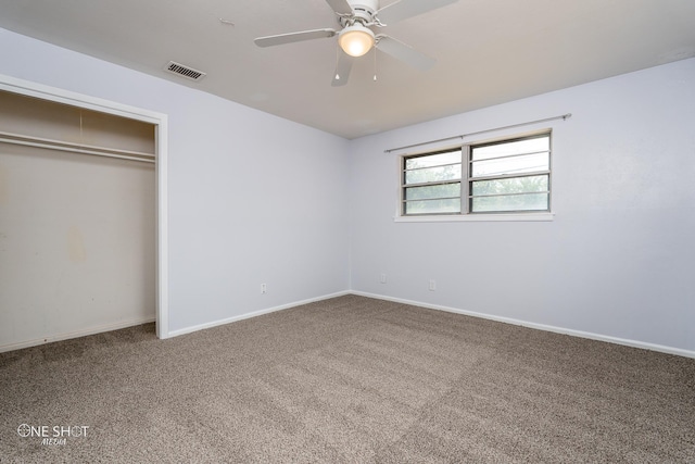 unfurnished bedroom with carpet, ceiling fan, and a closet