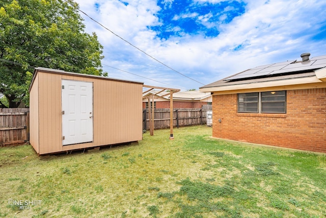 view of yard featuring a storage unit