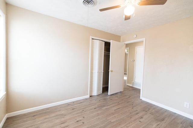 unfurnished bedroom with a closet, ceiling fan, and light hardwood / wood-style floors