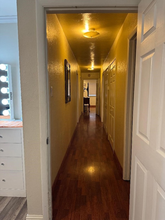 hall with dark hardwood / wood-style flooring