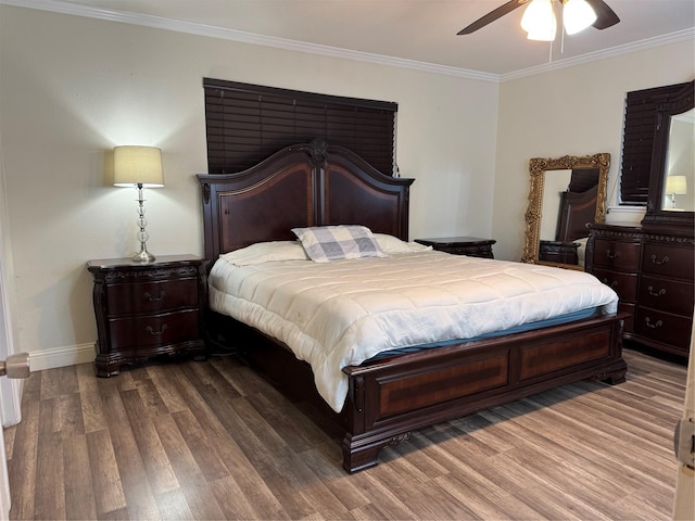 bedroom featuring crown molding, hardwood / wood-style floors, and ceiling fan