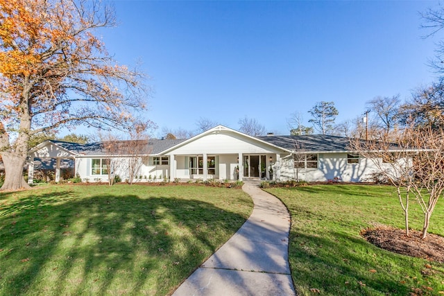 ranch-style home with a front lawn