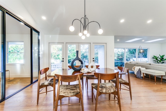 dining area featuring a chandelier and light hardwood / wood-style floors