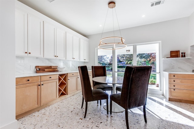 dining space with an inviting chandelier