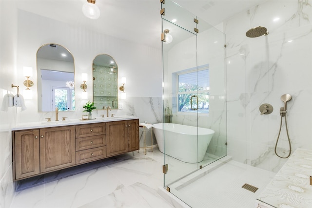 bathroom featuring plus walk in shower, tile walls, and vanity