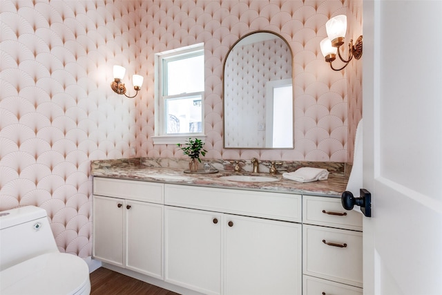 bathroom with vanity, hardwood / wood-style floors, and toilet