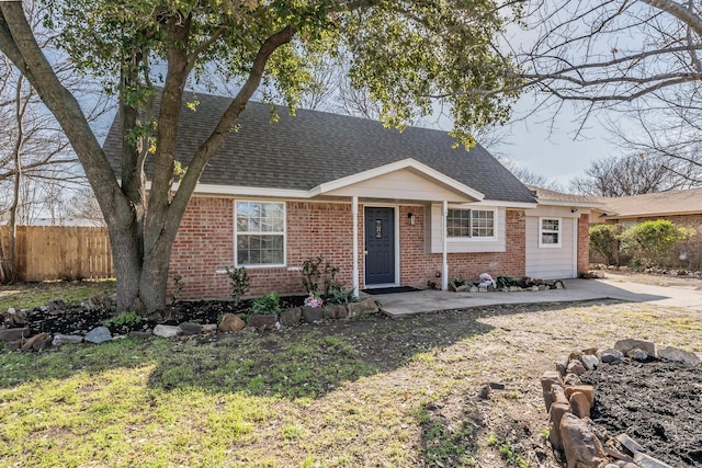 view of front of house with a front lawn and a patio area