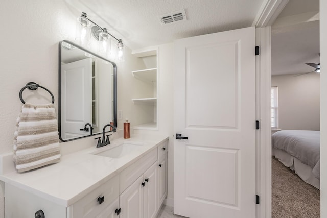 bathroom featuring vanity and a textured ceiling