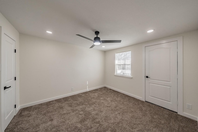 empty room with carpet floors and ceiling fan