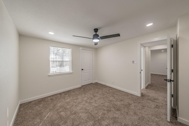 unfurnished bedroom with light carpet and ceiling fan