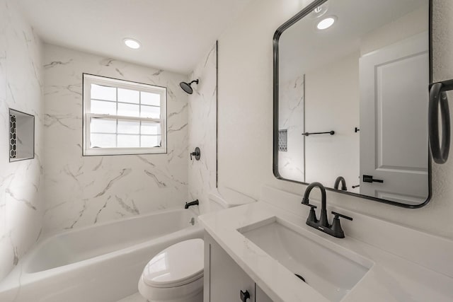 full bathroom with tiled shower / bath, vanity, and toilet