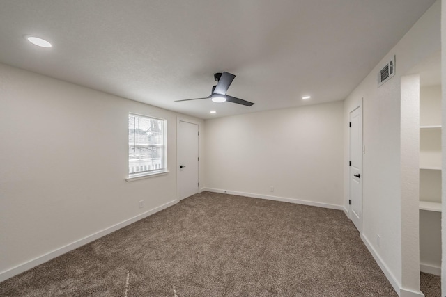 carpeted empty room with ceiling fan