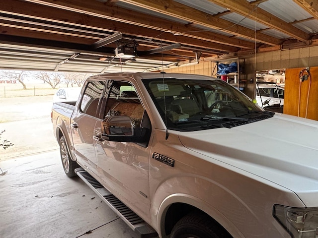 garage with a garage door opener and washer and clothes dryer