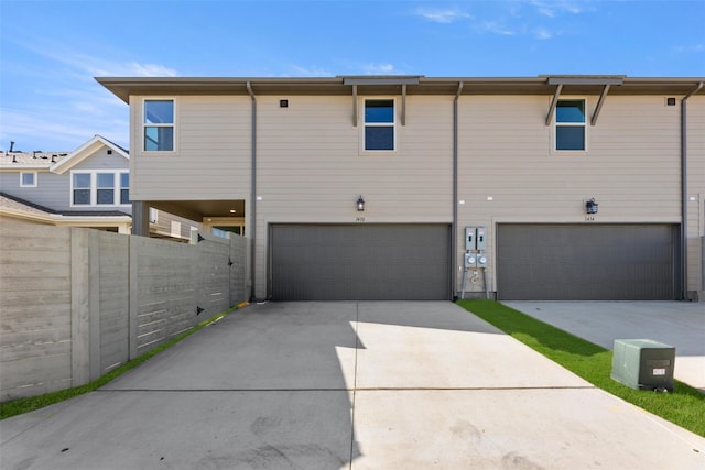 back of house with a garage