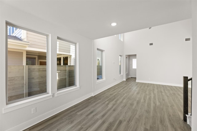 empty room with hardwood / wood-style flooring