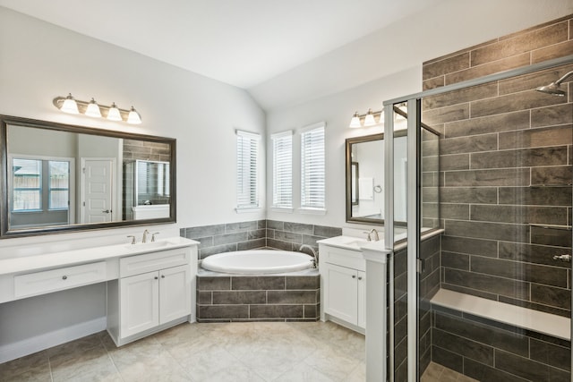 bathroom with tile patterned flooring, vanity, lofted ceiling, and plus walk in shower