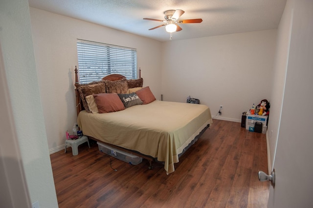 bedroom featuring ceiling fan and dark hardwood / wood-style floors