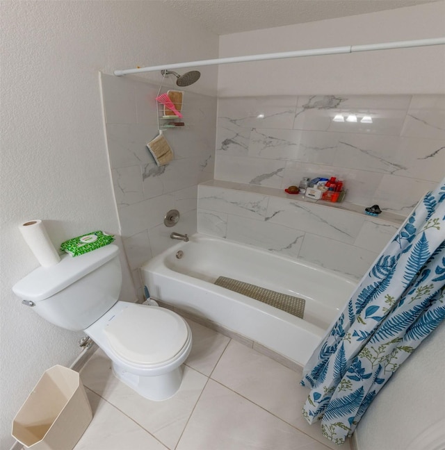 bathroom with toilet, tile patterned floors, and shower / bath combo with shower curtain