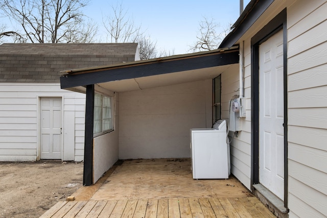 view of patio featuring washer / clothes dryer and a wooden deck