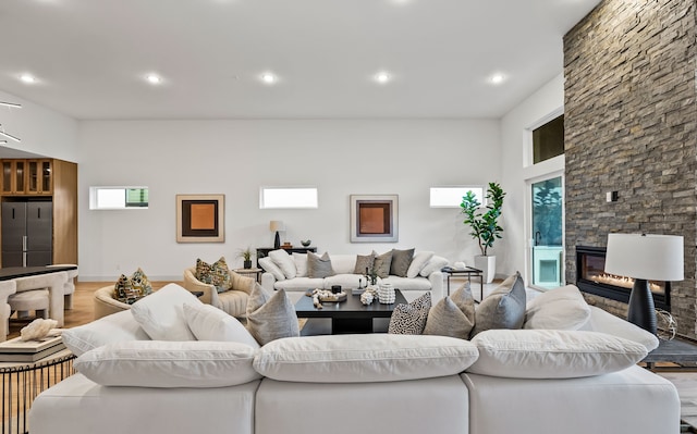 living room featuring hardwood / wood-style flooring and a fireplace