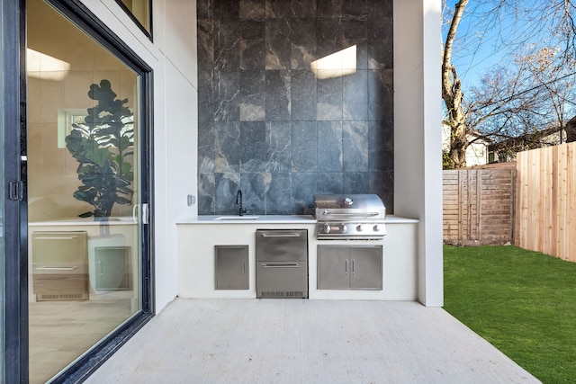 view of patio featuring area for grilling, grilling area, and sink