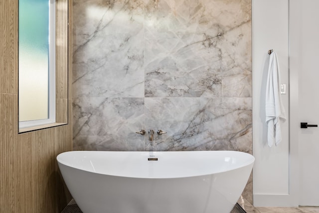 bathroom featuring a tub to relax in