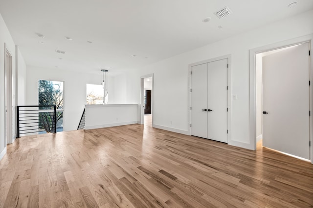 unfurnished room featuring light wood-type flooring