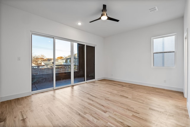 unfurnished room with ceiling fan and light hardwood / wood-style flooring