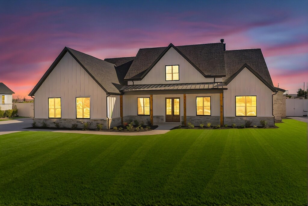4923 County Road 1093, Celeste, TX 75423 - back house at dusk with a lawn
