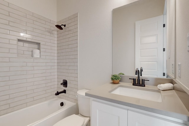 full bathroom with vanity, toilet, and tiled shower / bath combo