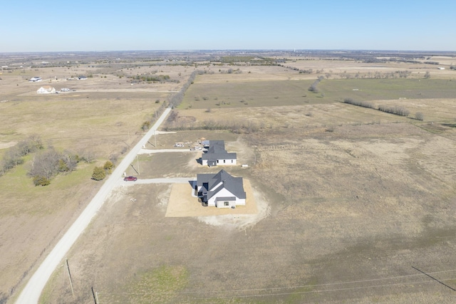 birds eye view of property featuring a rural view