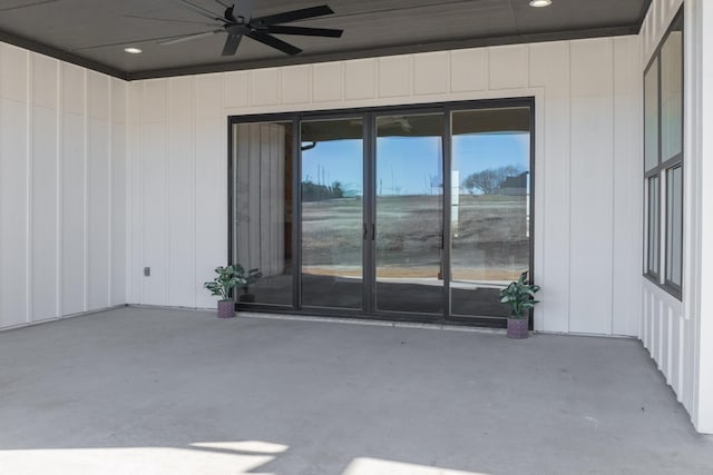 exterior space with ceiling fan