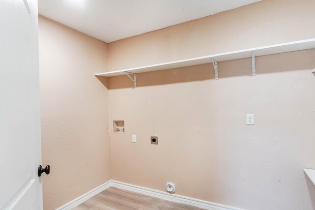 washroom with wood-type flooring, washer hookup, and hookup for an electric dryer