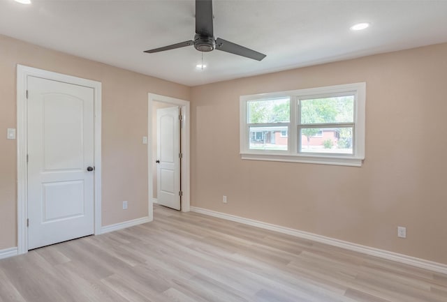 unfurnished bedroom featuring ceiling fan and light wood-type flooring