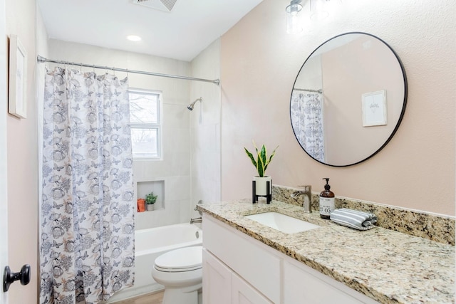 full bathroom featuring vanity, toilet, and shower / bath combo with shower curtain