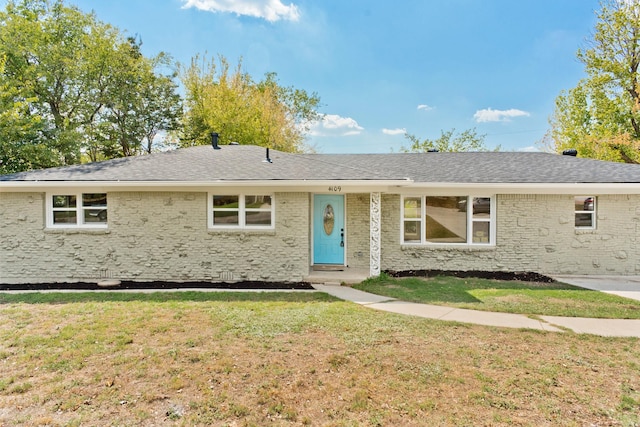 ranch-style home featuring a front yard