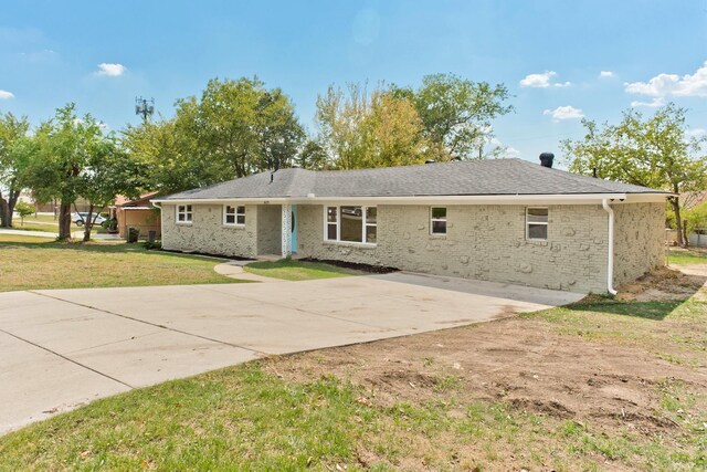 rear view of house with a yard