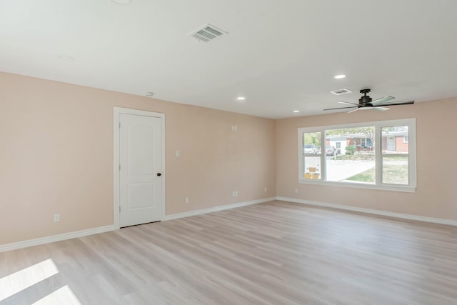 unfurnished room with ceiling fan and light wood-type flooring